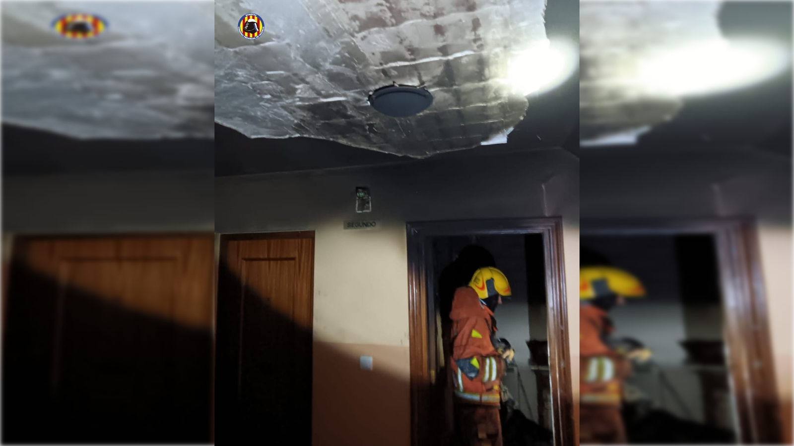 Un bomber en un dels replanells de la finca on ha ocorregut l'incendi, este dimecres