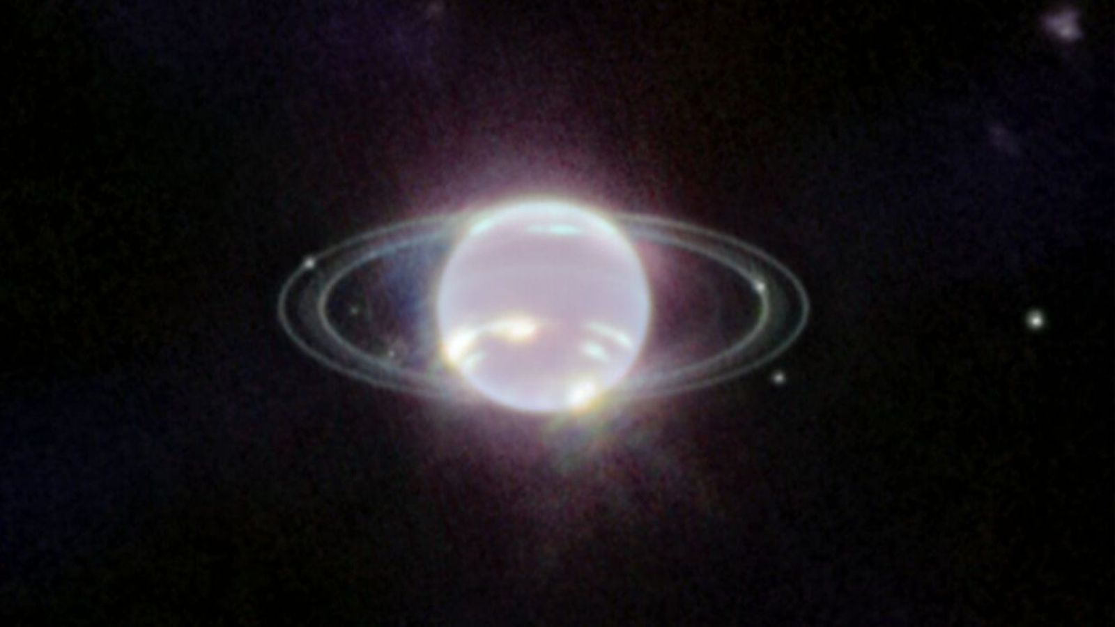 Fotografia de l'Agència Espacial Europea on s'aprecien ben definits els anells de Saturn, a més de set de les llunes que orbiten al voltant d'aquest planeta