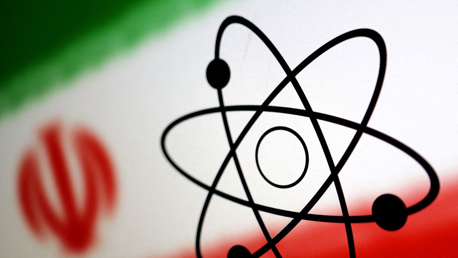 Símbol de l'energia atòmica sobre els colors de la bandera de l'Iran