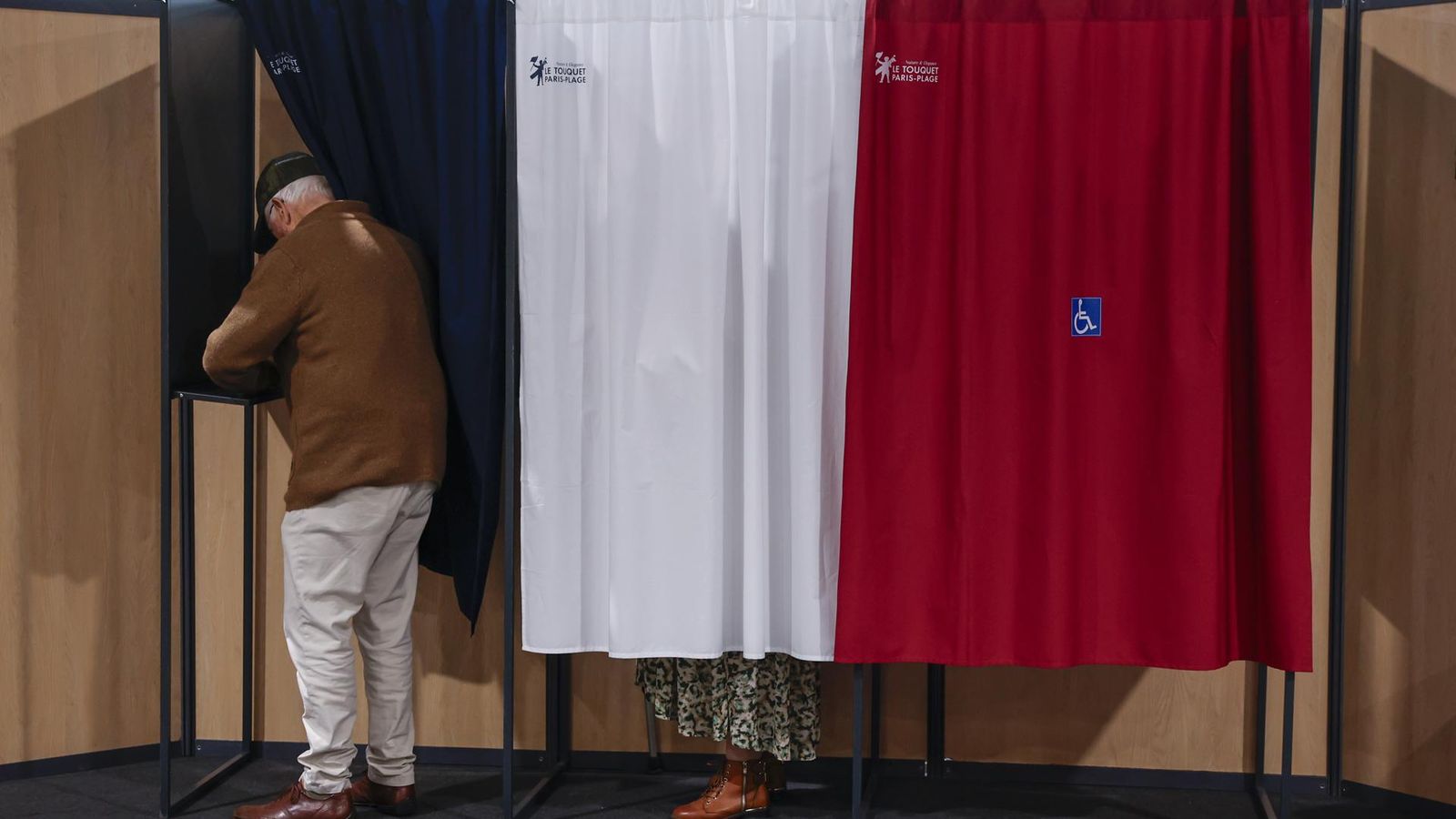 French President Macron votes in second round of parliamentary elections