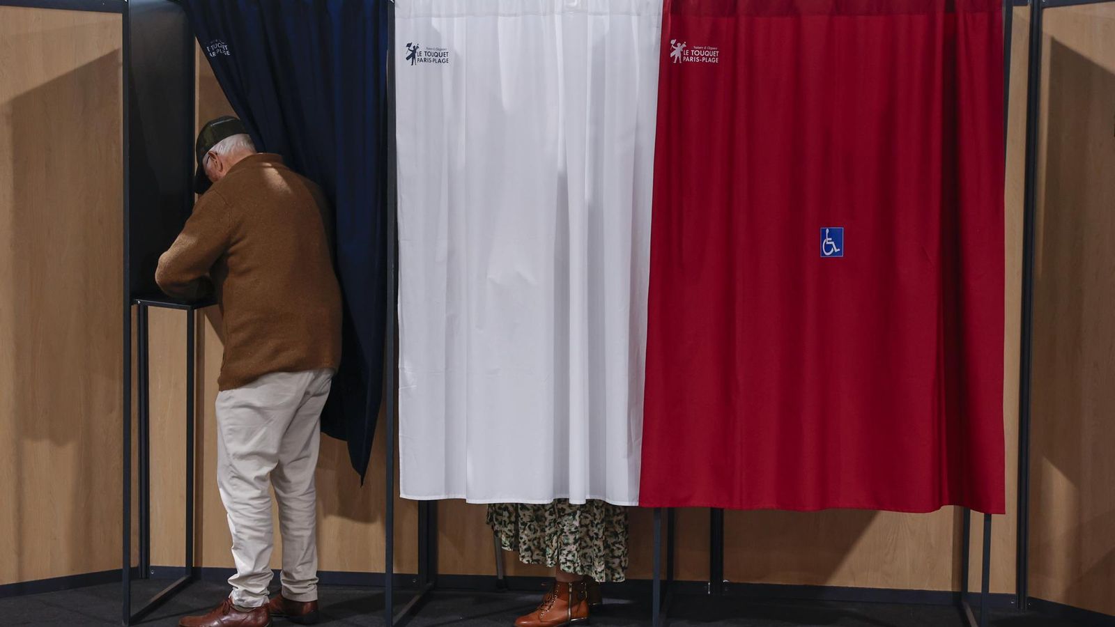 French President Macron votes in second round of parliamentary elections