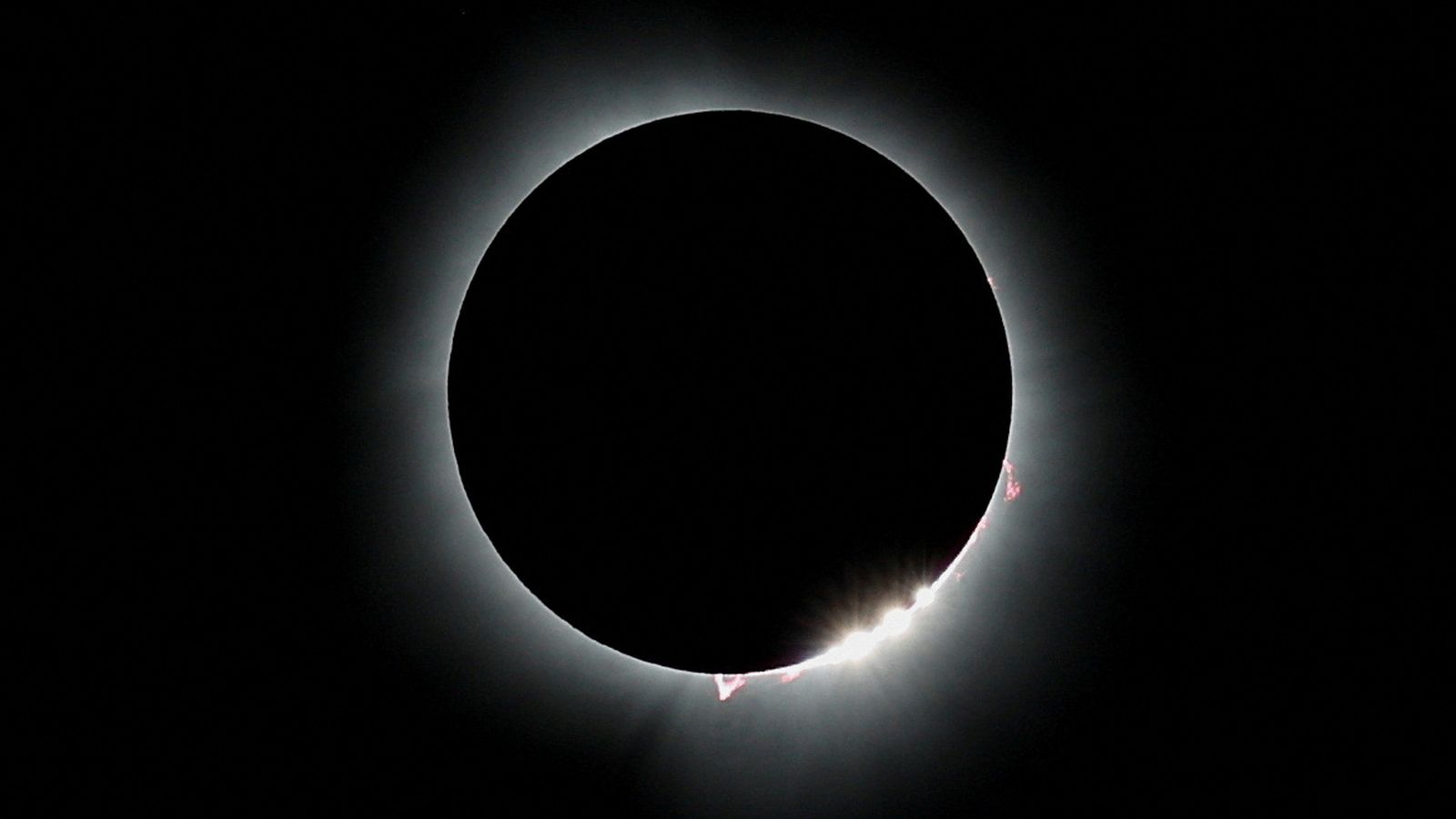 The moon blots out the sun, during a total solar eclipse, as seen from Carbondale, Illinois